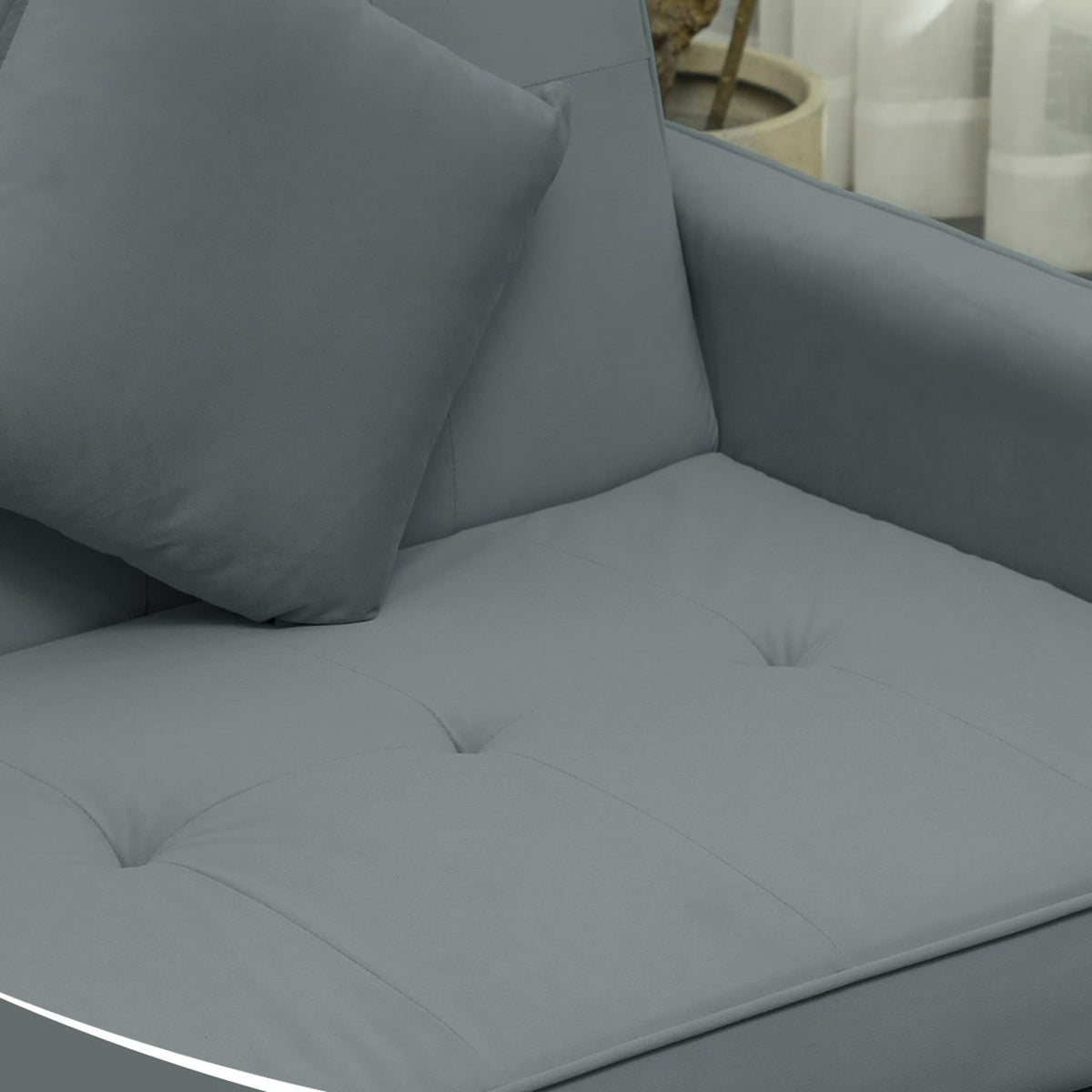Détail de l'assise capitonnée et d'un coussin d'Alizé, Gris orage